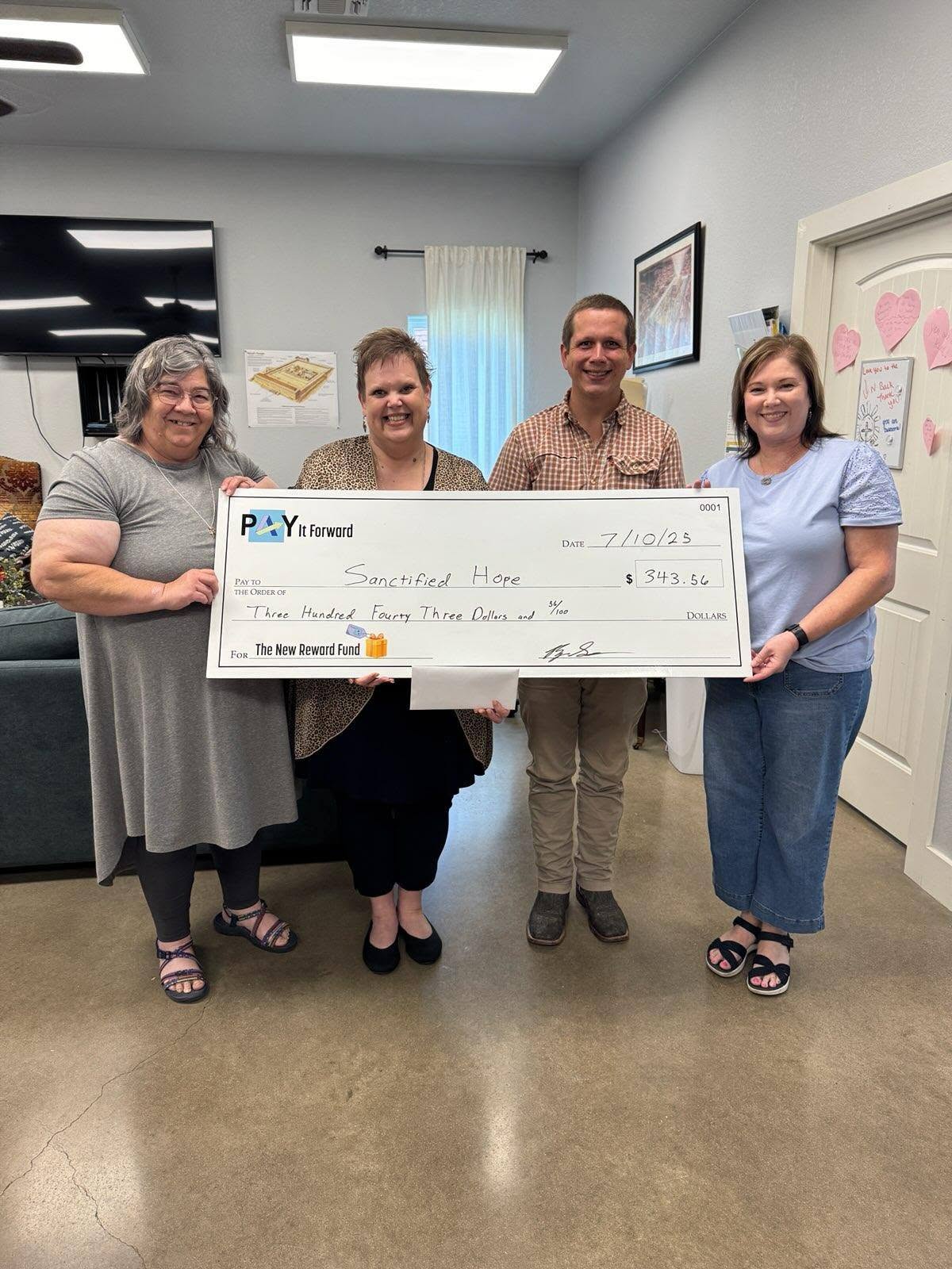 Pay It Forward donation presented to a local non-profit